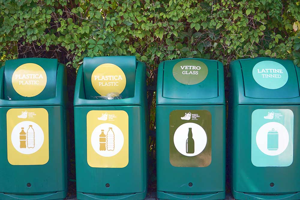 Waste management signs and symbols on a garbage bin